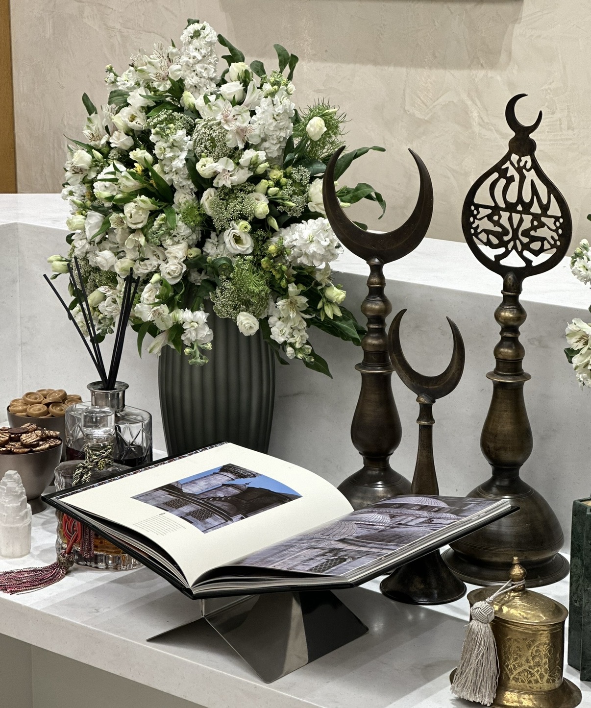 Corporate event setup with florals and curated objects