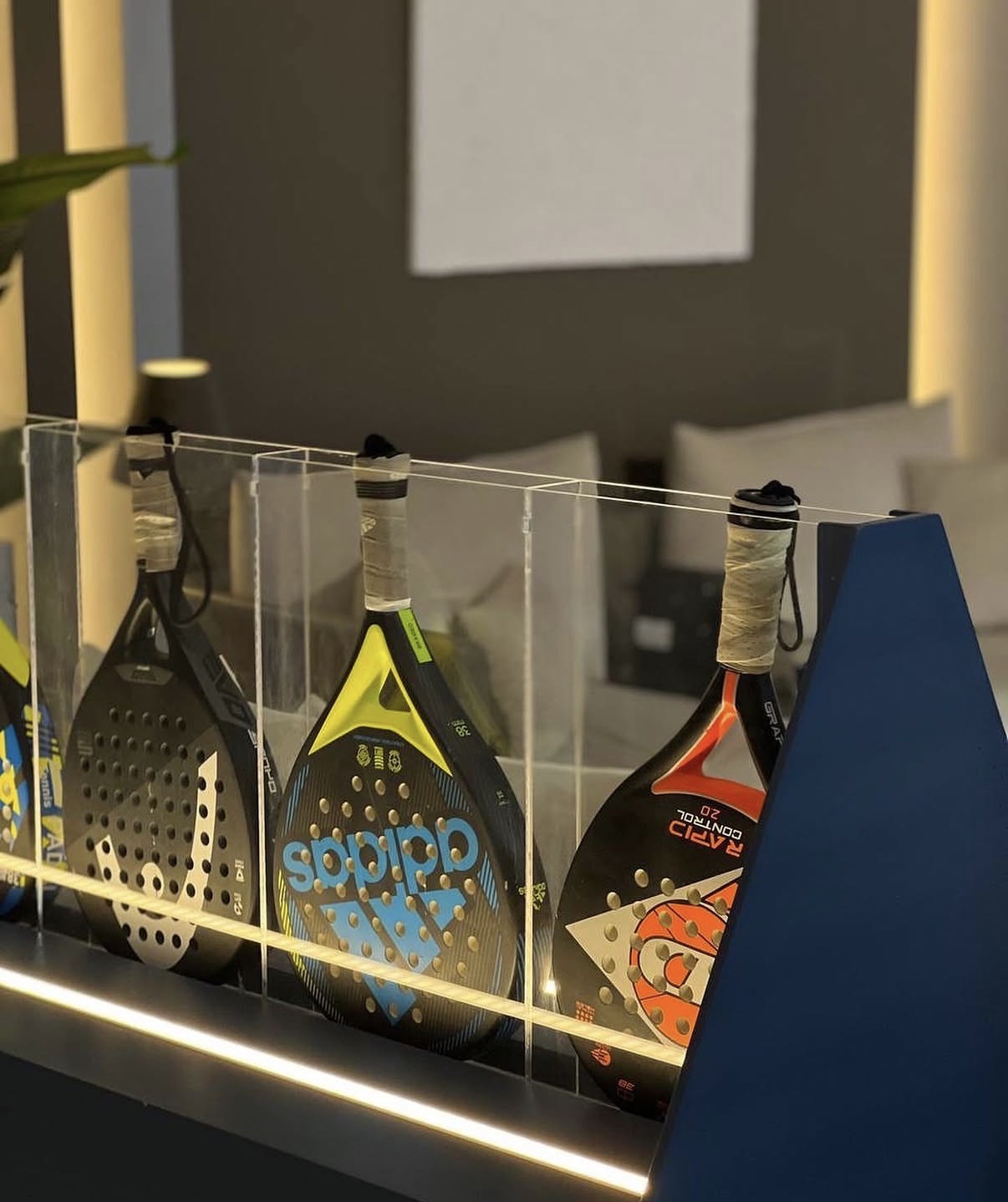 Padel racket display in a sports lounge